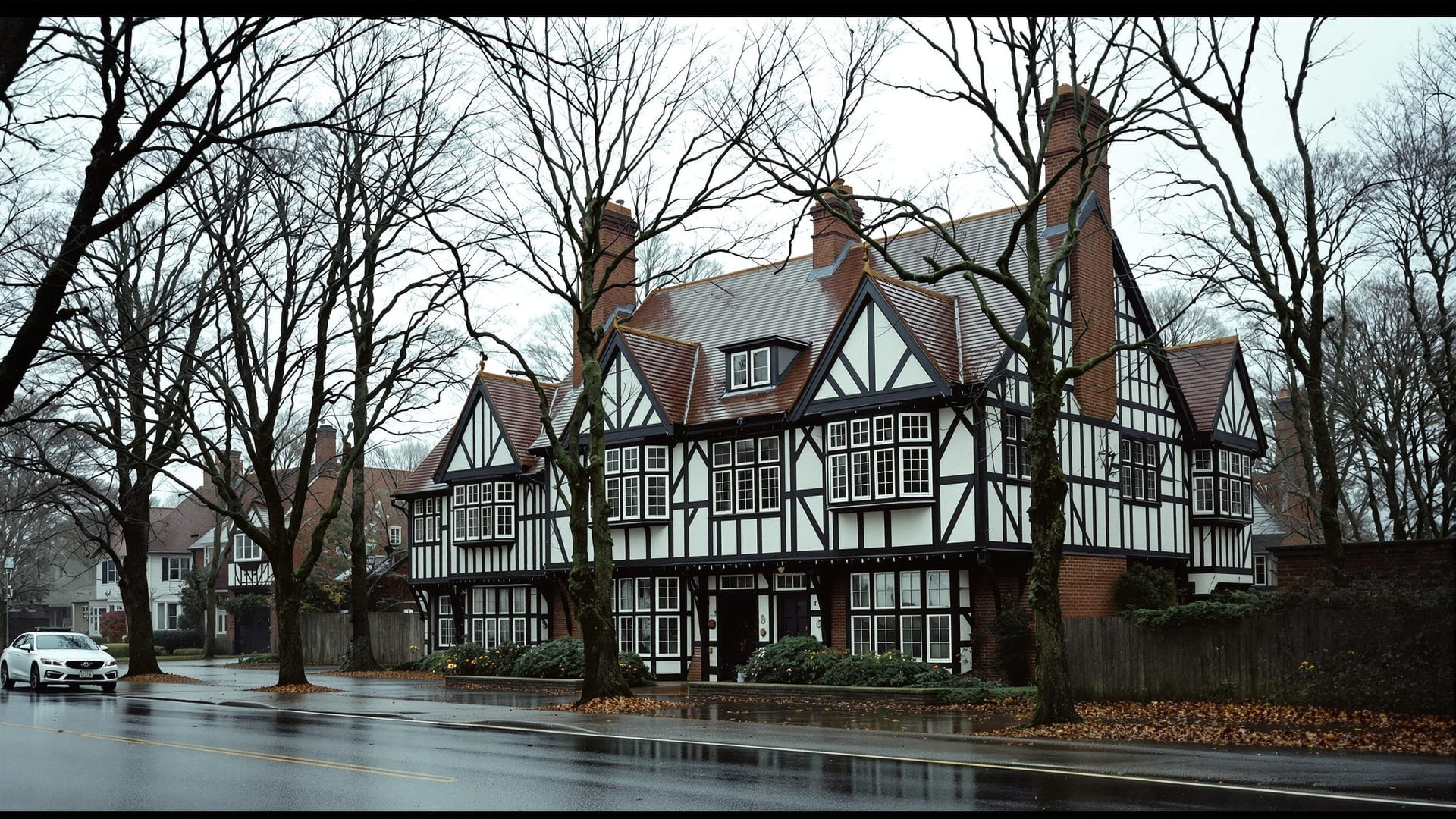 Tudor-facade bookshop building on a New England roadside in autumn